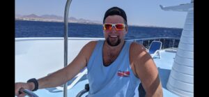 Captain Ron at the helm of a dive boat
